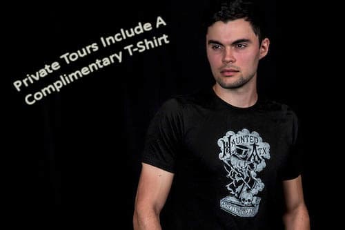 Male model displaying the free Haunted ATX shirt that comes with the private hearse limo tour